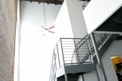 Metal stair case, historic brick architecture, hardwood ceilings