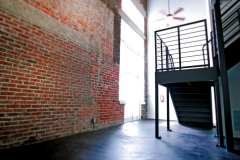 Old brick and new metal staircase at The Lofts San Marco